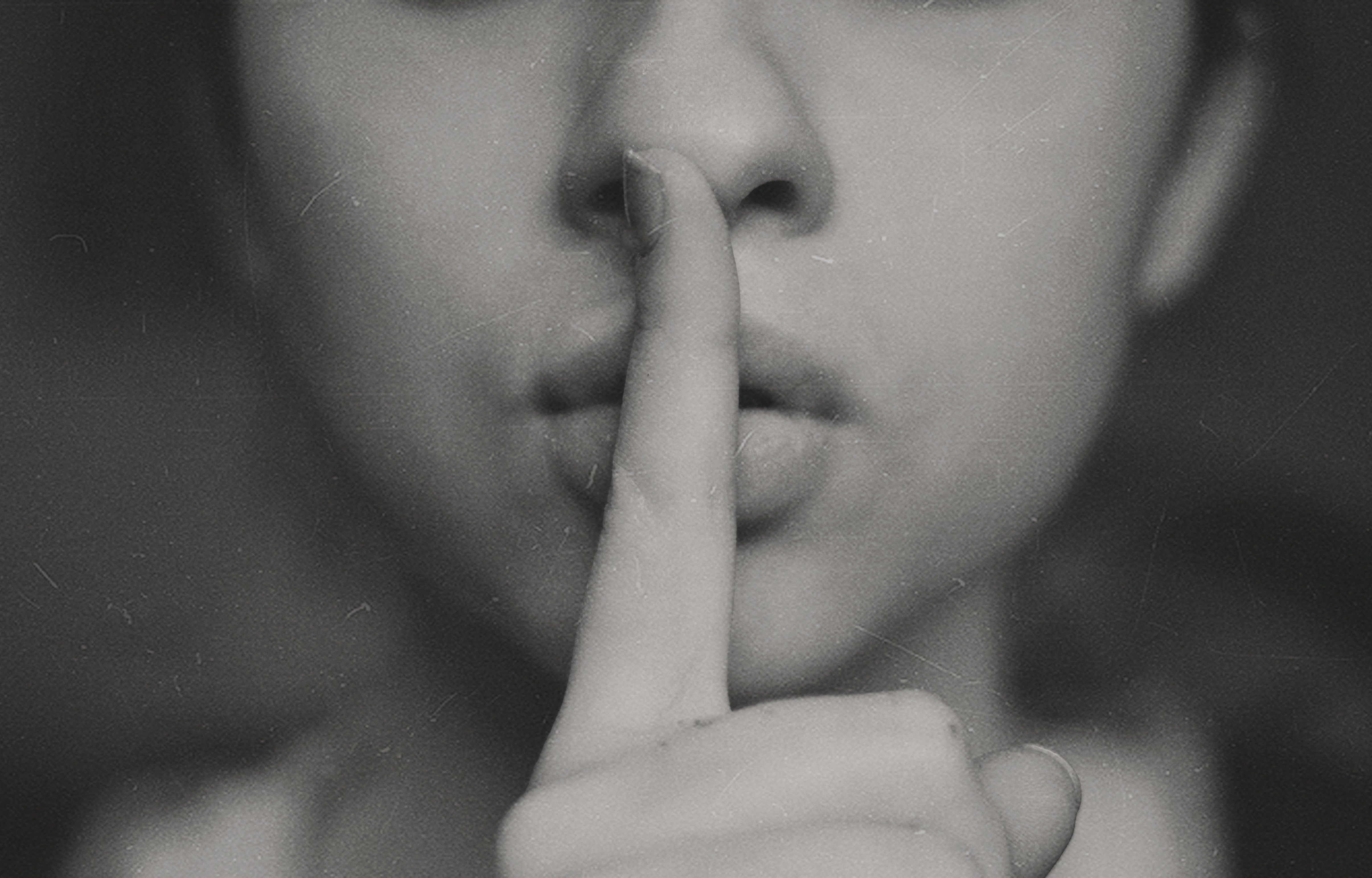 woman doing silent sign